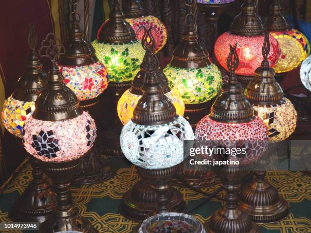 street shop selling products from morocco. colored glass lamps - genies lamp stock pictures, royalty-free photos & images