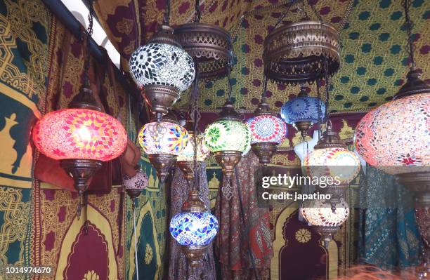 street shop selling products from morocco. colored glass lamps - genies lamp stock pictures, royalty-free photos & images