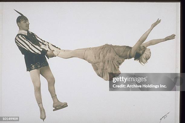 ice dancers, man swinging woman - figure skating couple stock pictures, royalty-free photos & images