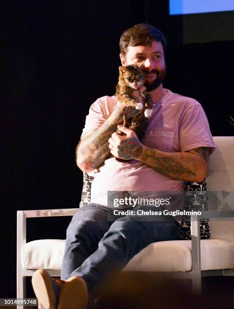 Lil Bub and Mike Bridavsky onstage during a panel at CatCon Worldwide 2018 at Pasadena Convention Center on August 5, 2018 in Pasadena, California.