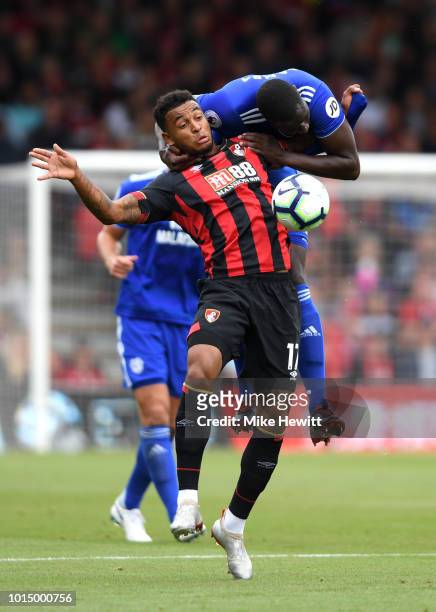 Joshua King of AFC Bournemouth is challenged by Sol Bamba Cardiff City during the Premier League match between AFC Bournemouth and Cardiff City at...