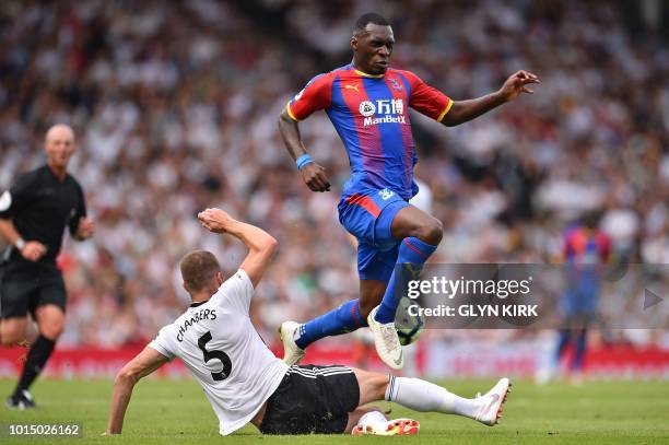 Crystal Palace's Zaire-born Belgian striker Christian Benteke vies with Fulham's English defender Calum Chambers during the English Premier League...