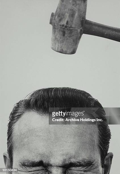 mallet comes down to hit mans head, 1950s - man headache bildbanksfoton och bilder
