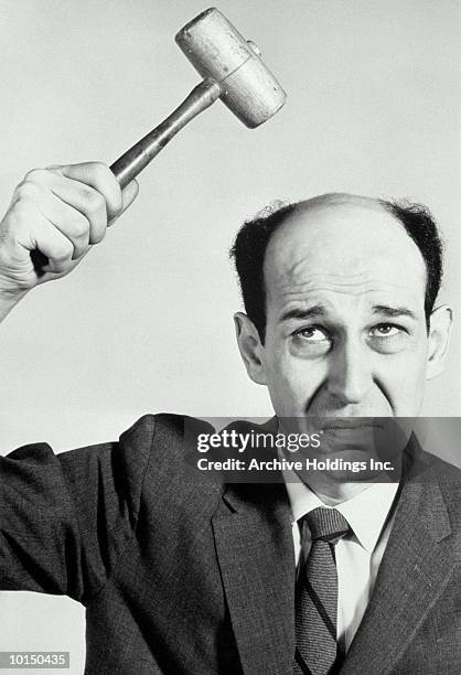 balding man prepares to hit his head - wally stock pictures, royalty-free photos & images