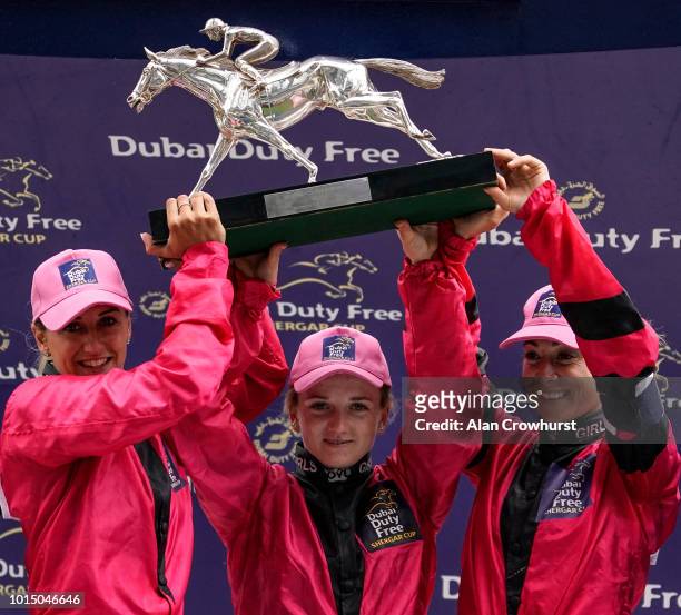 Jockeys, L-R, Josephine Gordon, Hollie Doyle and Hayley Turner hold the Shergar Cup aloft after at Ascot Racecourse on Shergar Cup Day on August 11,...