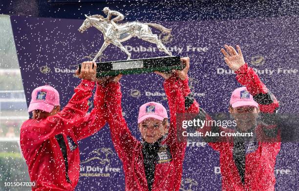 Jockeys, L-R, Josephine Gordon, Hollie Doyle and Hayley Turner hold the Shergar Cup aloft at Ascot Racecourse on Shergar Cup Day on August 11, 2018...