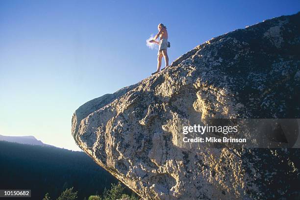 male rock climber on boulder lake tahoe - extreem weer stock pictures, royalty-free photos & images