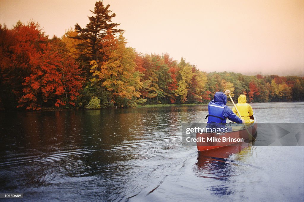 COUPLE CANOEING ON LAKE, CAMDEN, MAINE