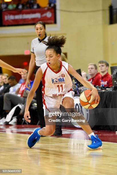 Kiki Rice of the Mid-Atlantic Girls handles the ball against the Midwest Girls during the Jr. NBA World Championship U.S. Semifinals on August 11,...