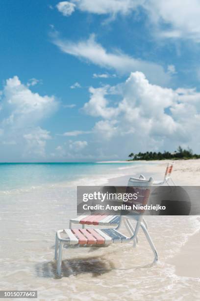 side view chairs on the beach, turks and caicos - turks and caicos islands stock-fotos und bilder