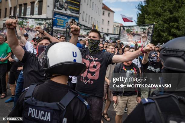 Right wing extremist try to block Participants of a gay pride parade guarded by the police on the streets of Poznan, August 11, 2018.