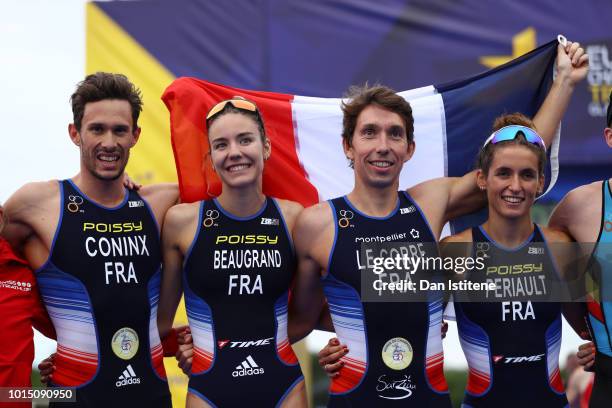 Dorian Coninx, Leonie Periault, Pierre Le Corre and Cassandre Beaugrand of France celebrates after winning the Mixed Team Relay Triathlon on Day Ten...