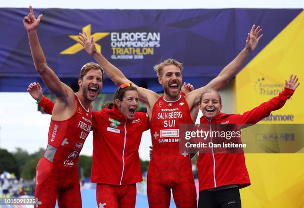 Sylvain Fridelance, Nicola Spirig, Andrea Salvisberg and Lisa Berger celebrates at the finish line after ending second during the Mixed Team Relay...