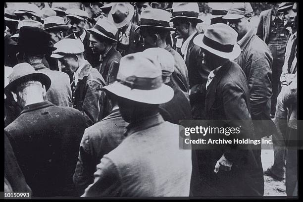 crowd of men, 1930, jackets and hats - facts stock pictures, royalty-free photos & images