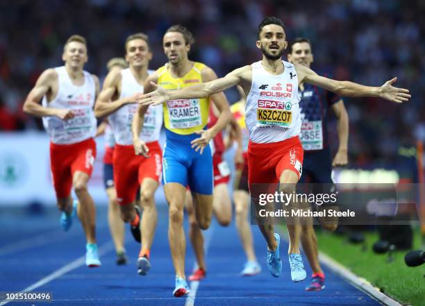 Adam Kszczot of Poland celebrates winning Gold in the Men's 800m during day five of the 24th European Athletics Championships at Olympiastadion on...