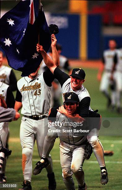 Adam Burton and Paul Gonzalez of Australia celebrate as Australia defeat Cuba 4-3 during the IBA Intercontinental Baseball Cup final at the Baseball...