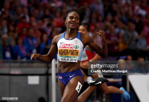 Dina Asher-Smith of Great Britain crosses the line to win gold during day five of the 24th European Athletics Championships at Olympiastadion on...
