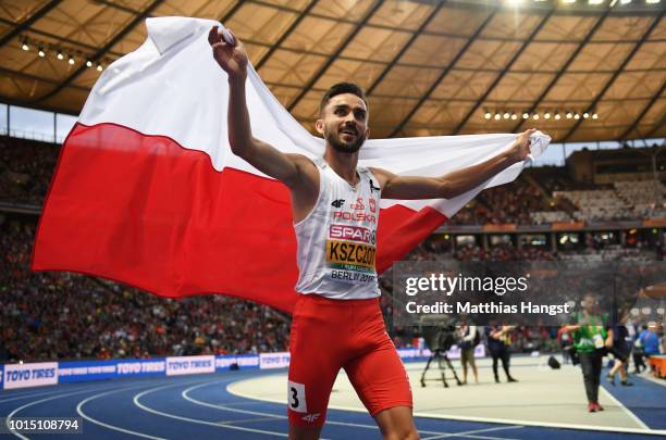 Adam Kszczot of Poland celebrates winning Gold in the Men's 800m during day five of the 24th European Athletics Championships at Olympiastadion on...