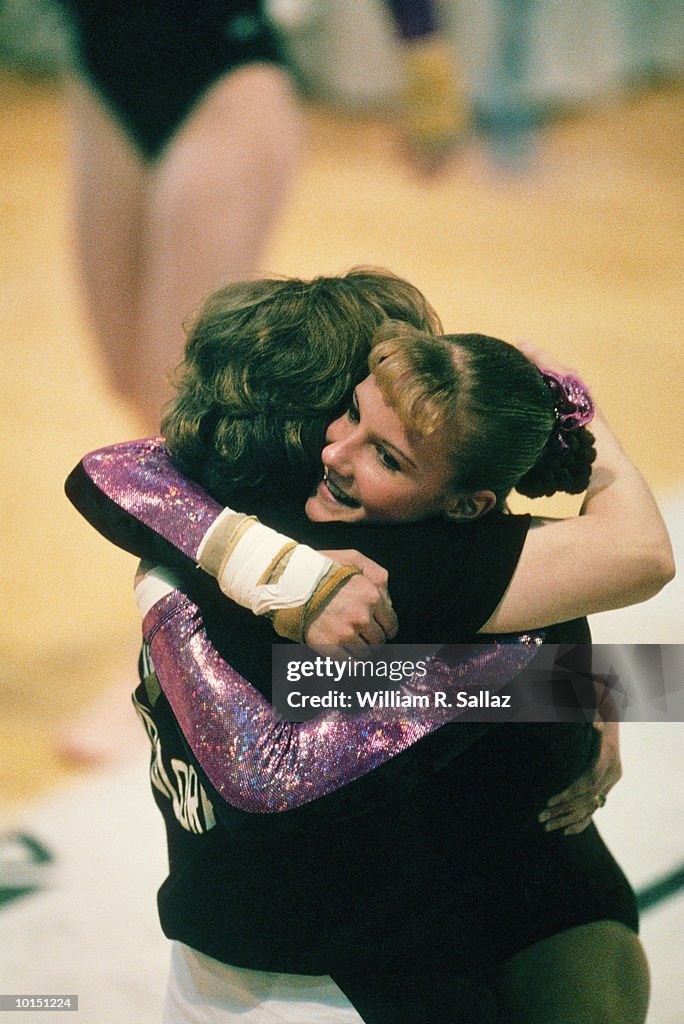 GYMNASTICS, YOUNG WOMAN AND COACH