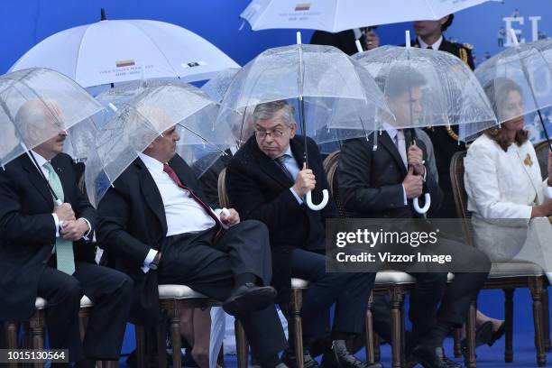 Formers Presidents of Colombia Andres Pastrana, Ernesto Samper and Cesar Gaviria look on during the swearing in ceremony of newly elected President...