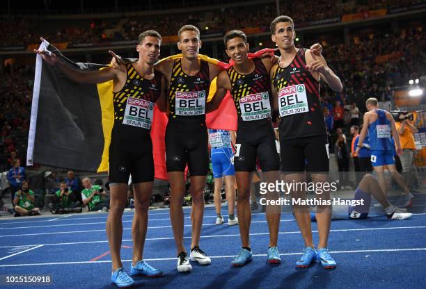 Dylan Borlee, Jonathan Borlee, Kevin Borlee and Jonathan Sacoor of Belgium celebrate winning the gold medal in the Men's 4 x 400m Relay during day...