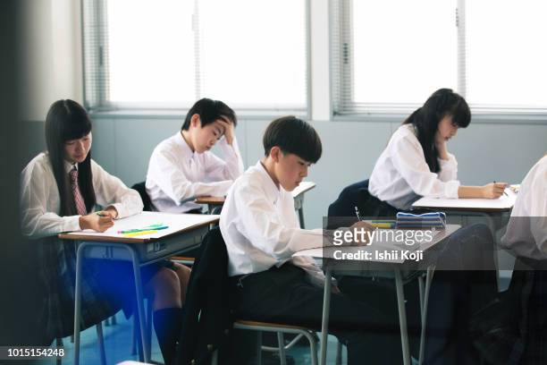 junior high school students in a class room - chinese student ストックフォトと画像