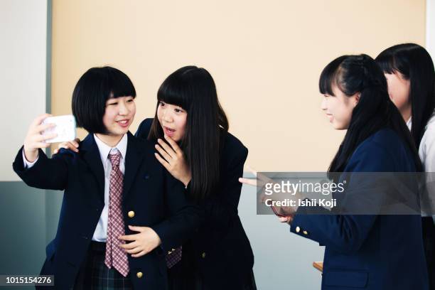 jr. high school, students taking selfie - japan 12 years girl stock pictures, royalty-free photos & images