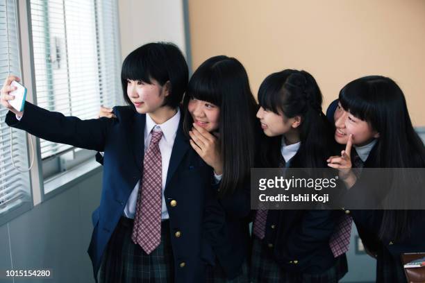 jr. high school, students taking selfie - japan 12 years girl stock pictures, royalty-free photos & images