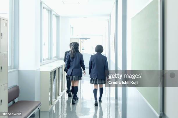 junior high school students on hallway - 中学校 ストックフォトと画像