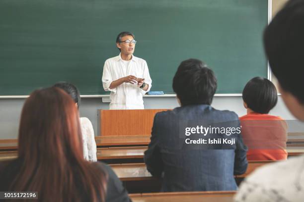 classroom scene of a japanese school - asian teacher stock pictures, royalty-free photos & images