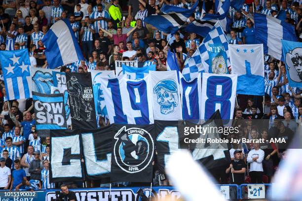 Fans of Huddersfield Town hold up banners and flags during the Premier League match between Huddersfield Town and Chelsea FC at John Smith's Stadium...