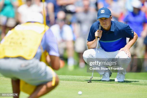 Jordan Spieth of the United States lines up a putt during the third round of the 2018 PGA Championship at Bellerive Country Club on August 11, 2018...