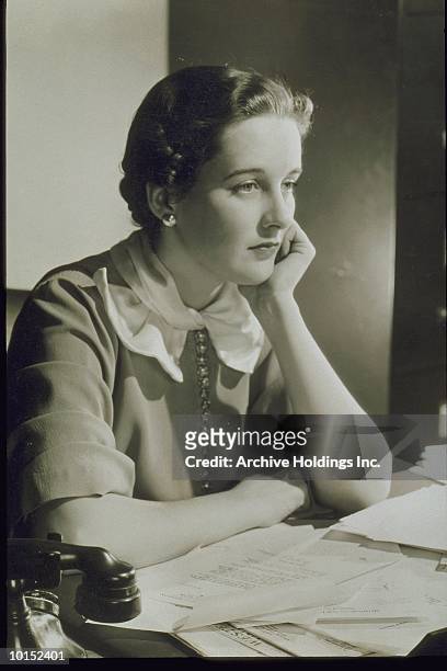 young woman seated at a desk, circa 1935 - 1930s woman stock pictures, royalty-free photos & images
