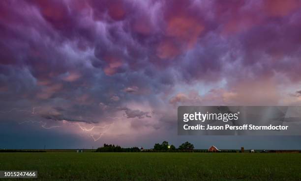 lightning under storm cloud over farmhouse, wray, colorado, us - mammatus cloud stock pictures, royalty-free photos & images