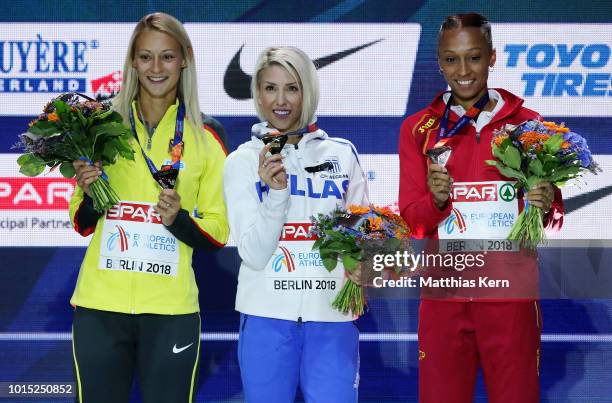 Kristin Gierisch of Germany, silver, Paraskevi Papahristou of Greece, gold, and Ana Peleteiro of Spain, bronze, pose with their medals for the...