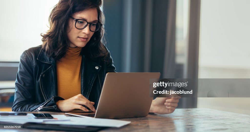 Asian woman working laptop at office
