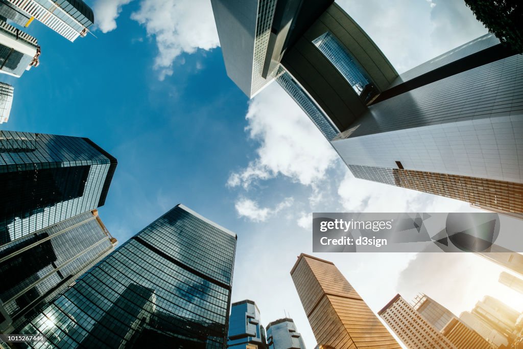 Low angle view of corporate skyscrapers with contemporary architectural design in Central Business District against clear blue sky