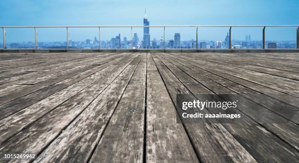 wooden balcony front of nanjing night skyline - wooden railing stock pictures, royalty-free photos & images