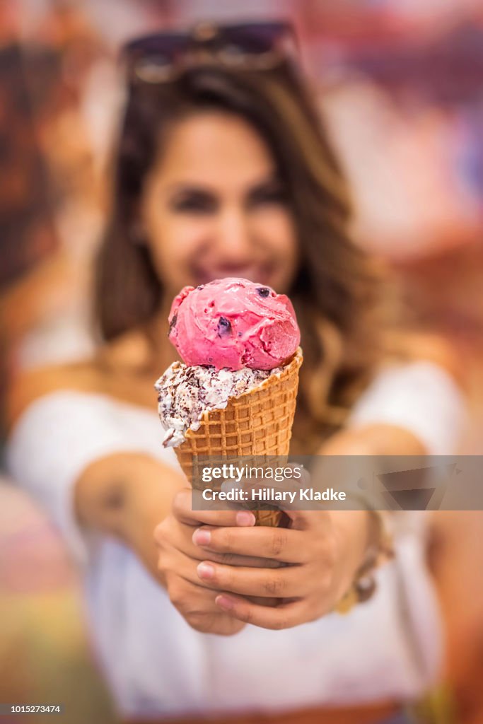 Brunette woman holding ice cream