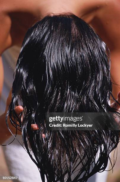 woman running fingers through hair, rear view, close-up - wet hair stock pictures, royalty-free photos & images