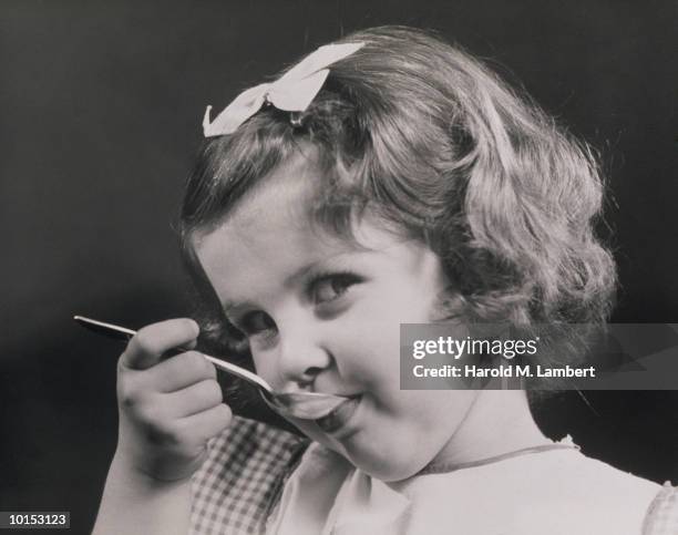 Girl Holding Spoon In Her Mouth, 1936