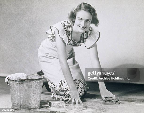 woman scrubbing floor, 1930s - gender gap stock pictures, royalty-free photos & images