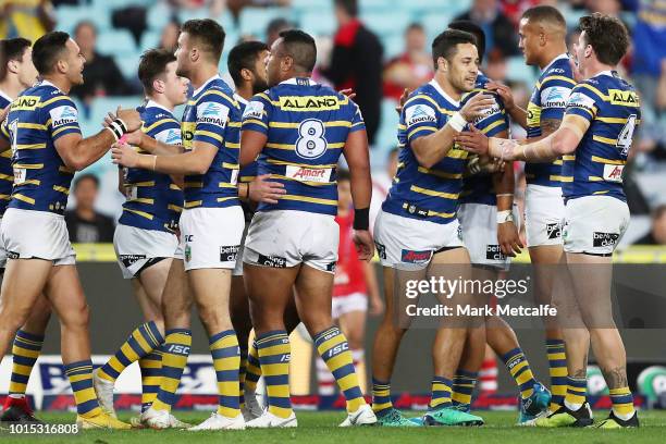 Jarryd Hayne of the Eels celebrates scoring a try with team mates during the round 22 NRL match between the Parramatta Eels and the St George...