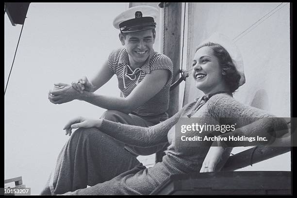 couple lounges on the deck of a boat, 1930s - 1930s era stock pictures, royalty-free photos & images