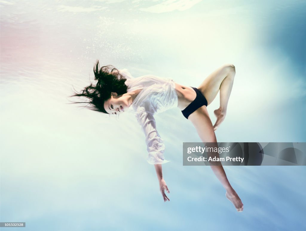 Woman underwater in zero gravity environment