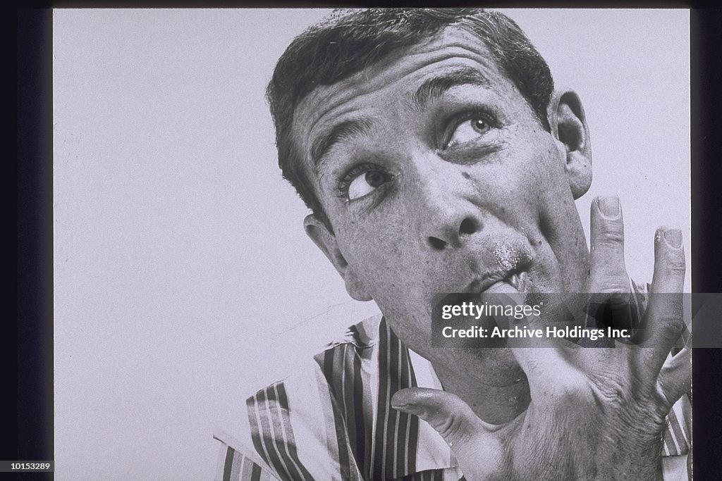 MAN SUCKING ON HIS POINTER FINGER, 1950S