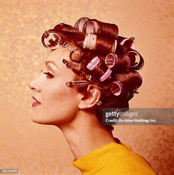 young woman wearing curlers, profile, 1960's - retro hairstyle stock pictures, royalty-free photos & images