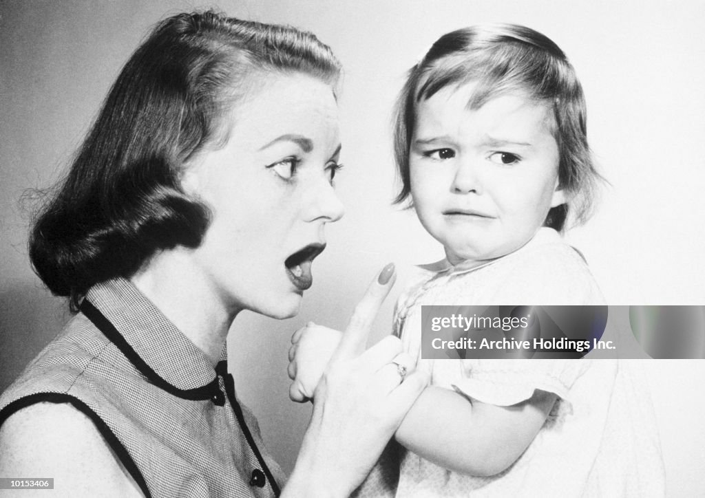 MOTHER SCOLDING CHILD NEAR TEARS, 1958
