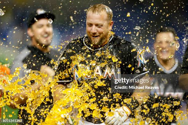 Bryan Holaday of the Miami Marlins celebrates after hitting a walk-off single in the eleventh inning to defeat the New York Mets 4-3 at Marlins Park...