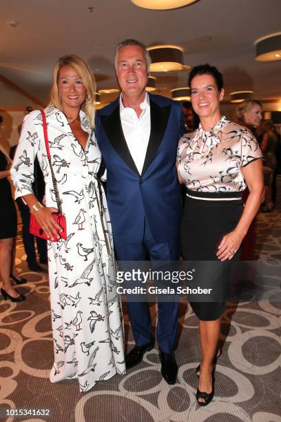 Franziska van Almsick, her partner Juergen B. Harder and Katarina, Kati, Witt during the 11th GRK Golf Charity Masters reception on August 11, 2018...